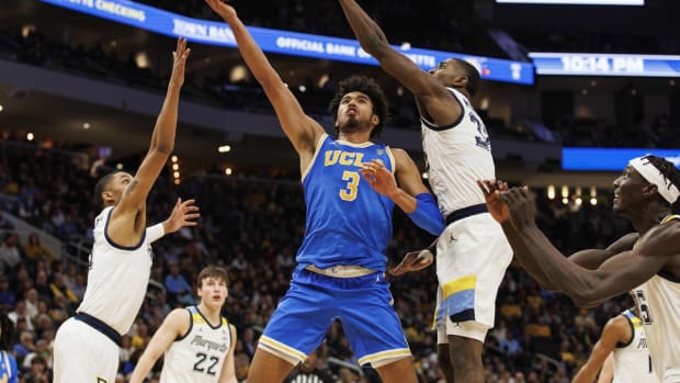 Dec 11, 2021; Milwaukee, Wisconsin, USA; UCLA Bruins guard Johnny Juzang (3) shoots during the second half against the Marquette Golden Eagles at Fiserv Forum. Mandatory Credit: Jeff Hanisch-USA TODAY Sports